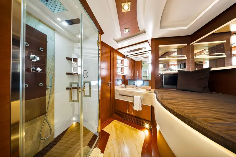 Babieca Yacht Photos Pics Luxurious interior of 2005 Azimut 105 yacht featuring elegant wood finishes and modern amenities.