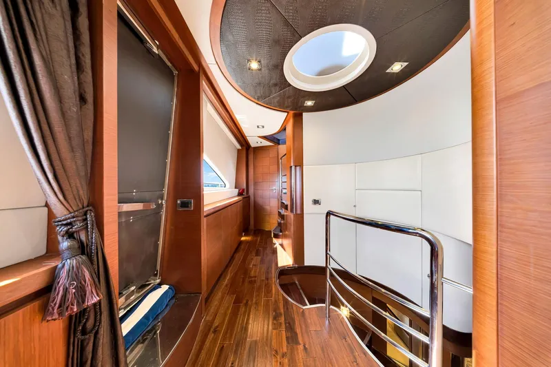 Babieca Yacht Photos Pics Luxurious interior of 2005 Azimut 105 yacht with elegant wood finishes and modern design.