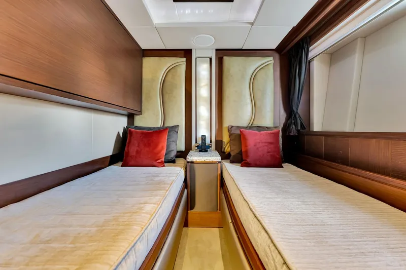 Babieca Yacht Photos Pics Luxurious twin cabin interior on 2005 Azimut 105 yacht, featuring elegant decor and plush bedding.
