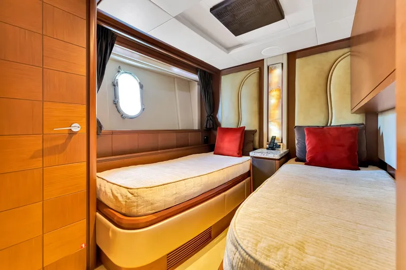 Babieca Yacht Photos Pics Luxurious cabin interior of 2005 Azimut 105 yacht with twin beds and elegant decor.