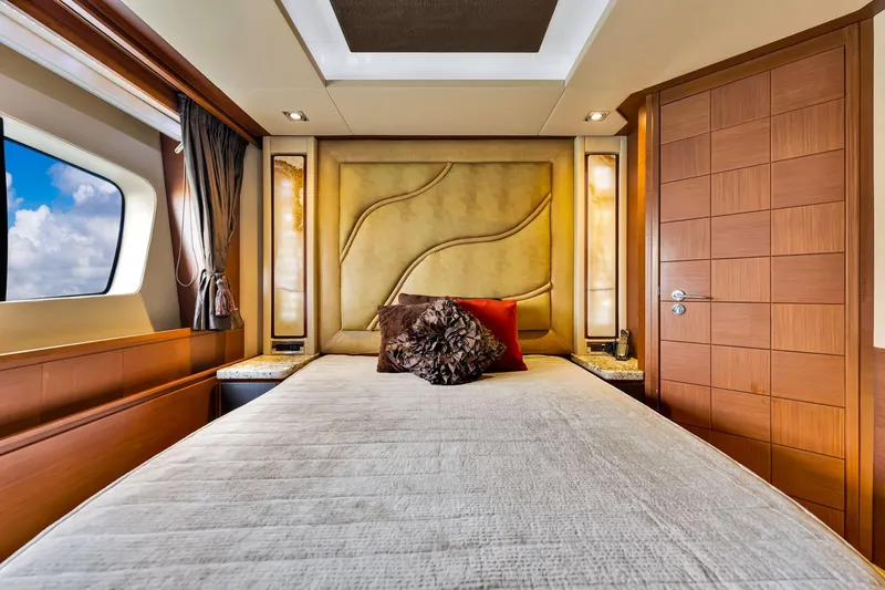 Babieca Yacht Photos Pics Luxurious bedroom interior of 2005 Azimut 105 yacht with elegant design and ocean view.