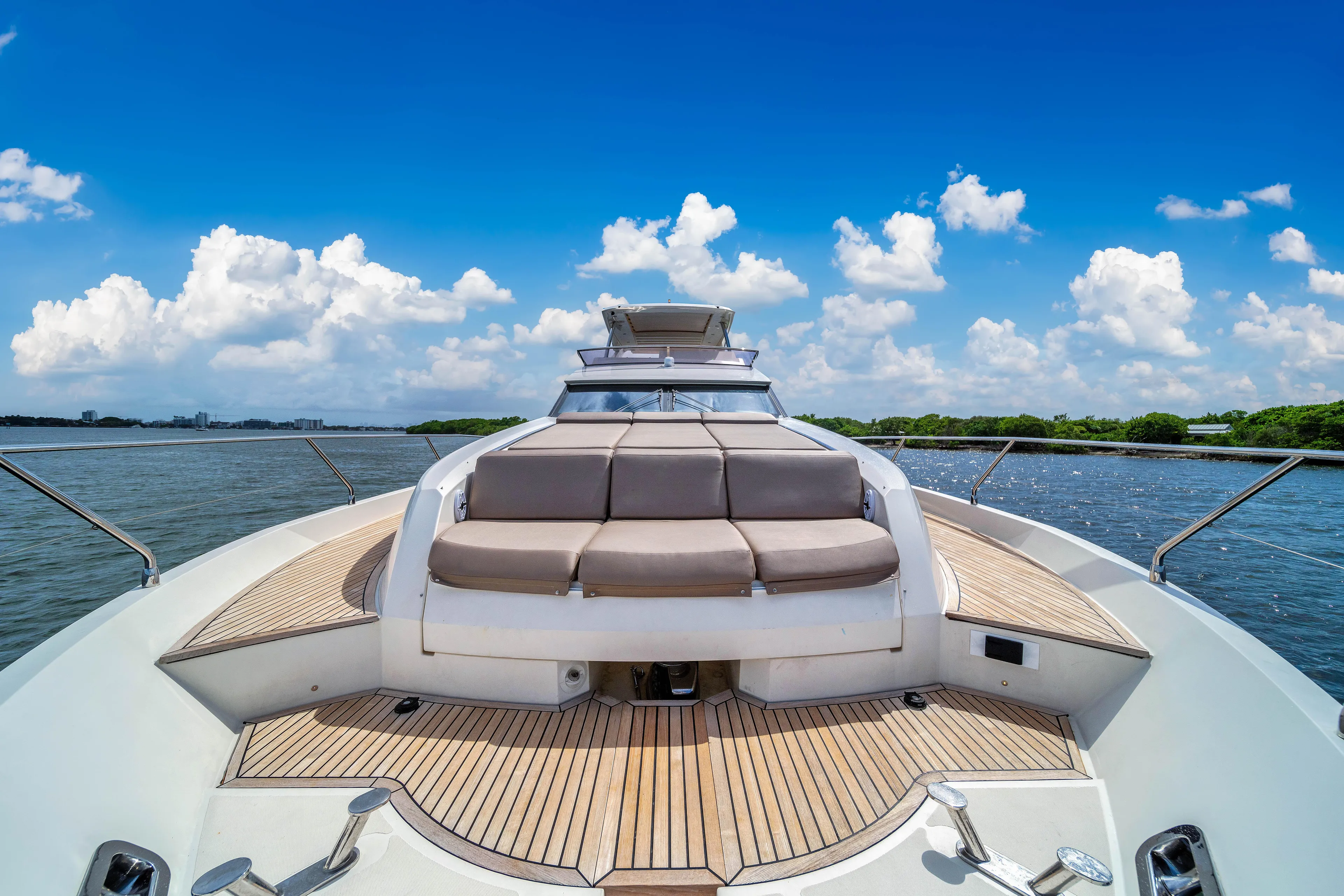 Oceana Yacht Photos Pics Luxury Prestige 750 yacht deck with sun loungers, 2015 model, under a clear blue sky.