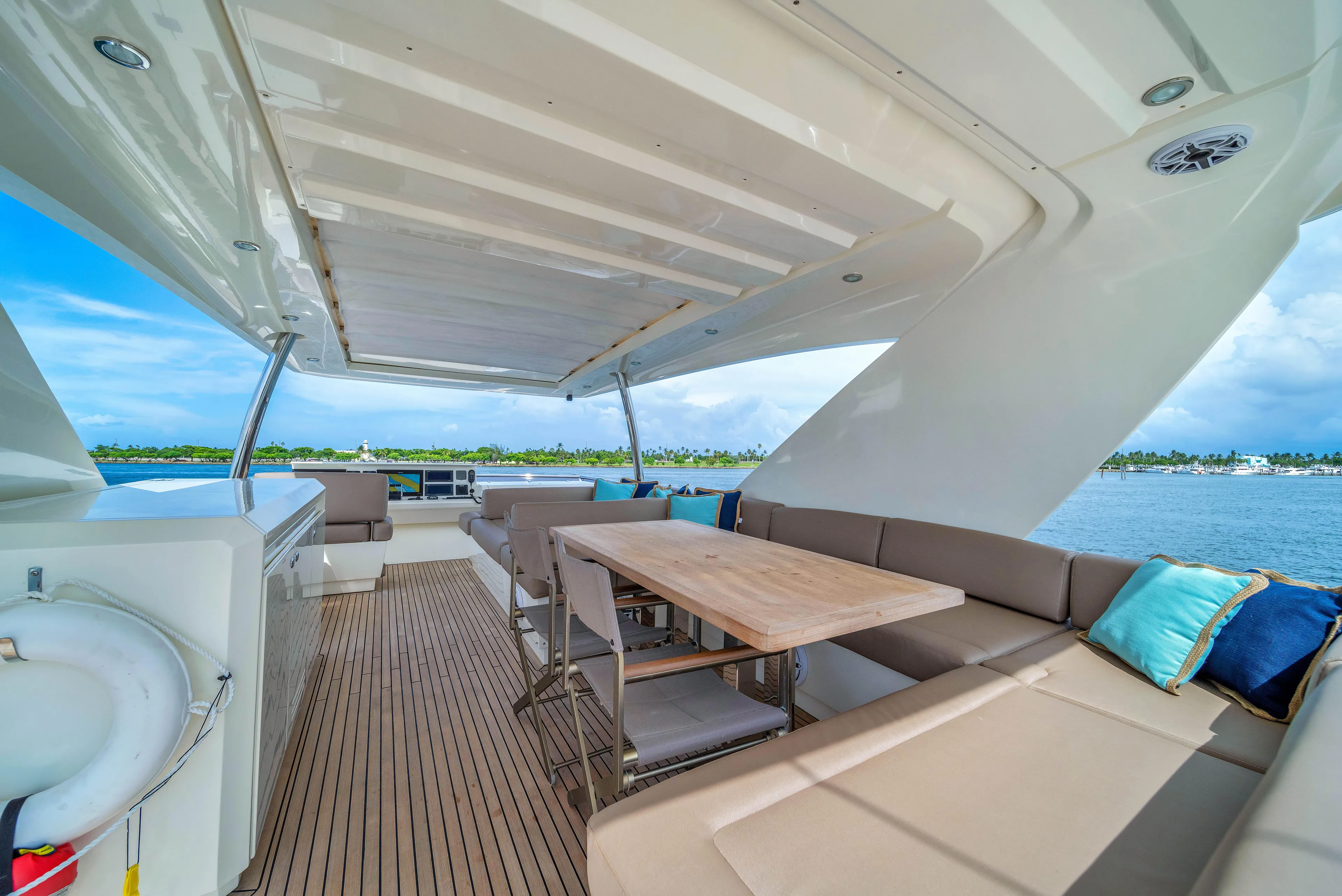 Oceana Yacht Photos Pics Luxurious 2015 Prestige 750 yacht deck with seating, table, and ocean view.