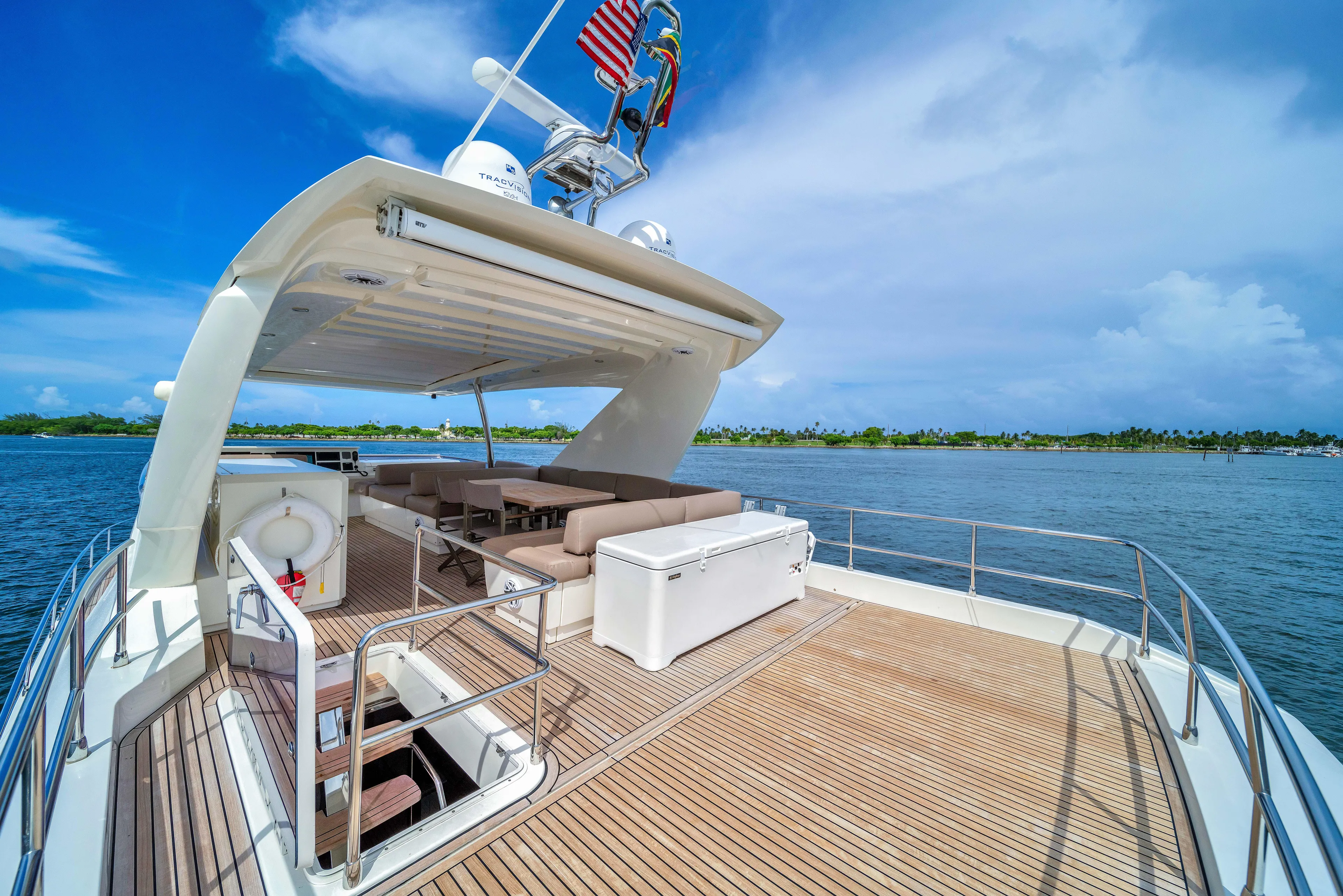 Oceana Yacht Photos Pics Luxurious 2015 Prestige 750 yacht with spacious deck and seating, cruising on a sunny day.