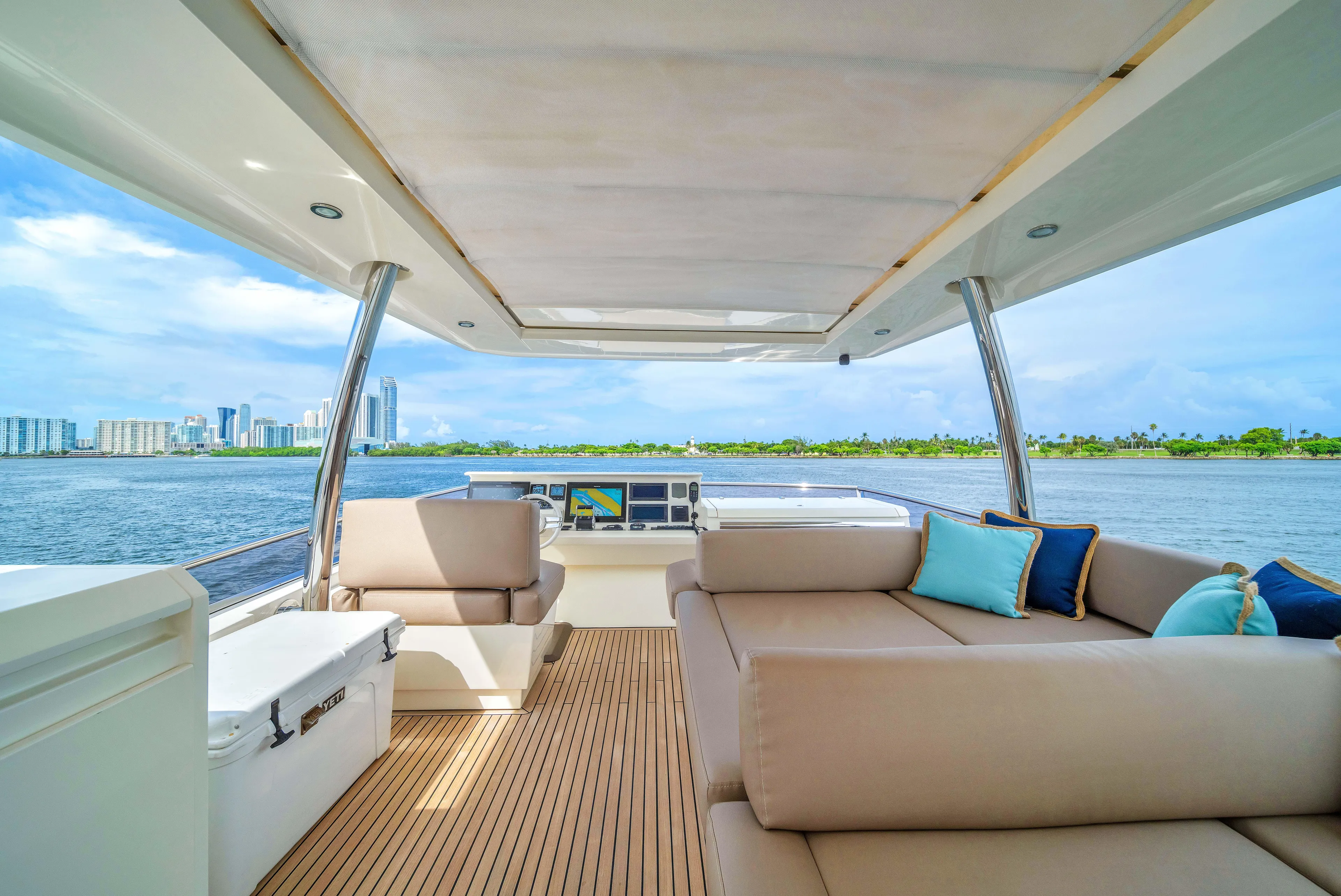 Oceana Yacht Photos Pics Luxurious 2015 Prestige 750 yacht interior with spacious seating and scenic waterfront view.