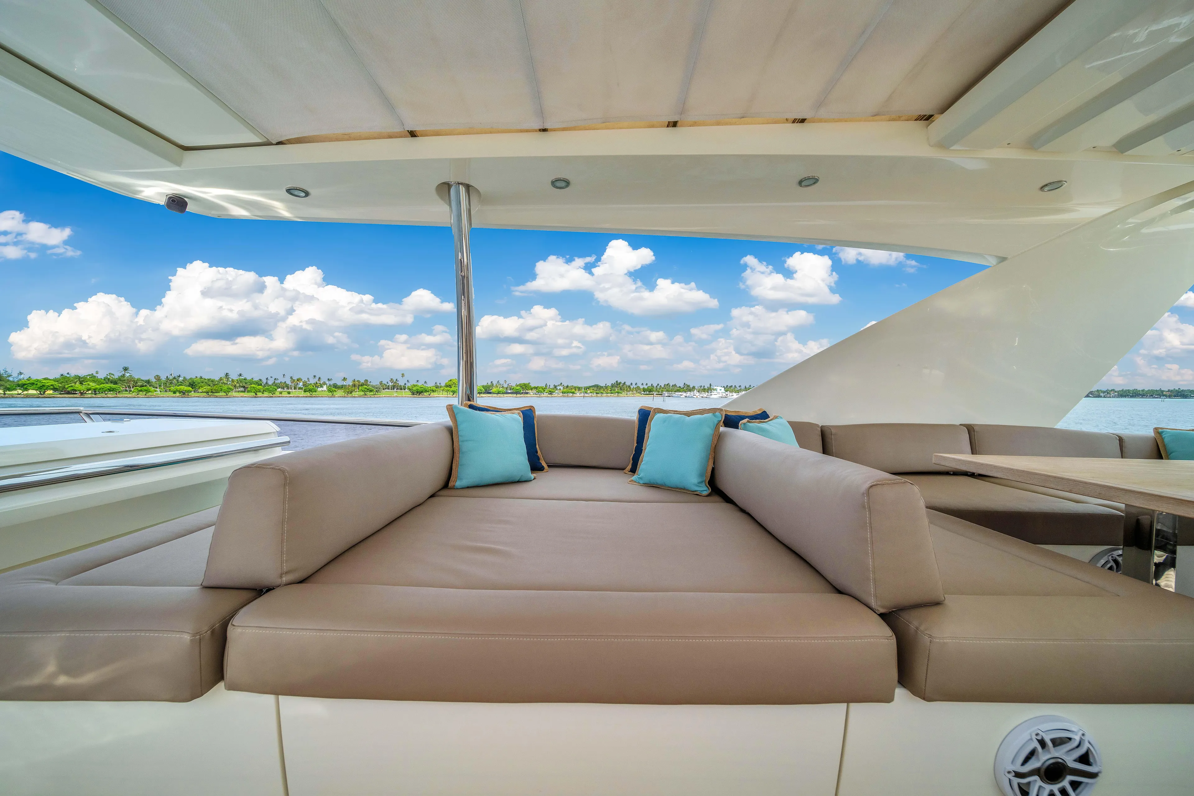 Oceana Yacht Photos Pics Luxurious seating area on a 2015 Prestige 750 yacht with scenic water view.