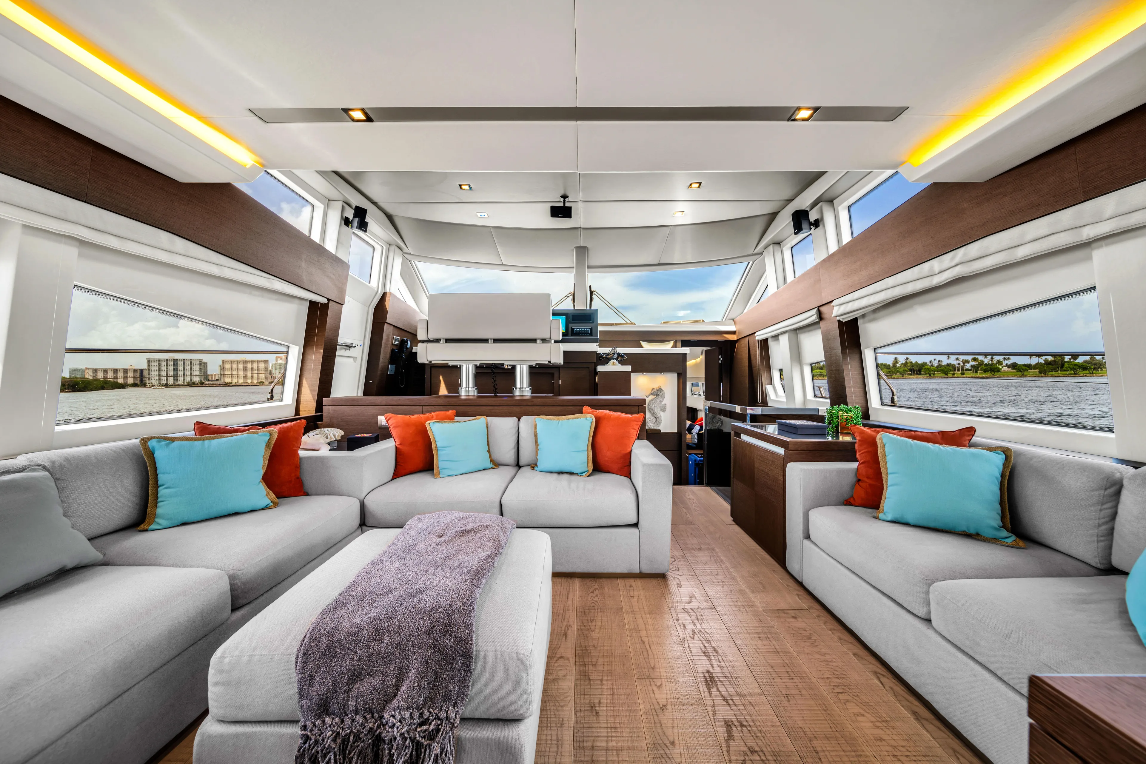 Oceana Yacht Photos Pics Luxurious interior of 2015 Prestige 750 yacht with modern sofas and vibrant cushions.