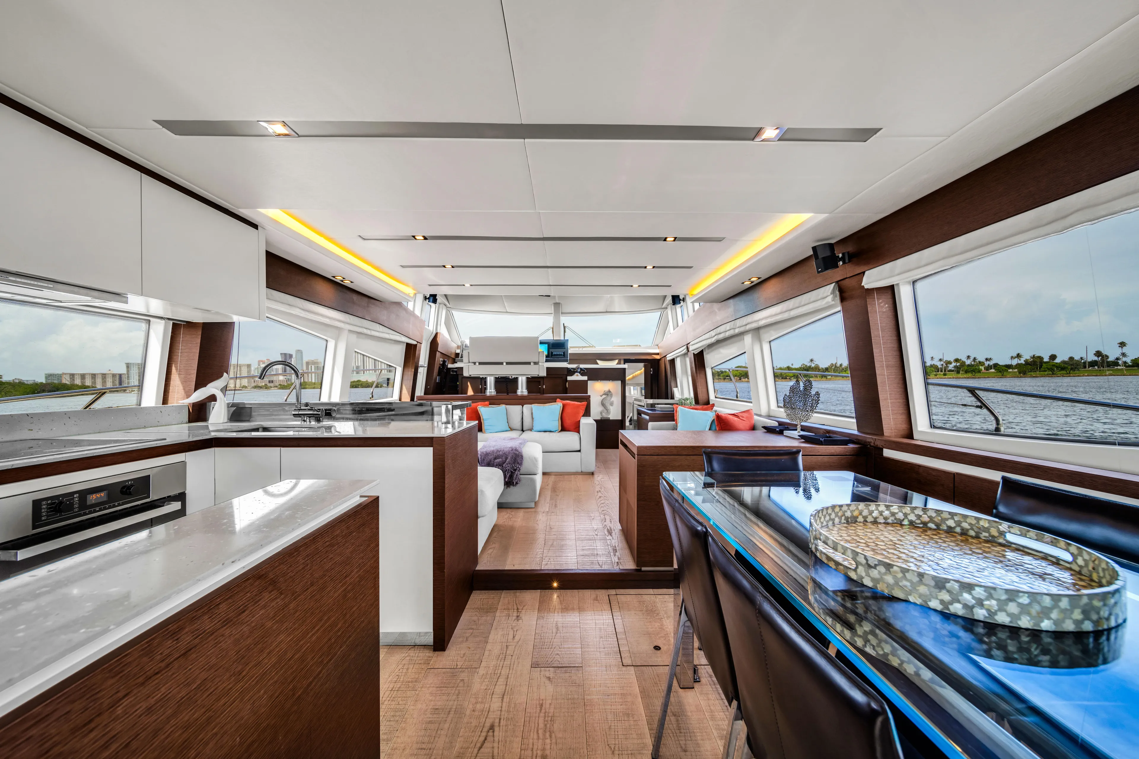 Oceana Yacht Photos Pics Luxurious interior of a 2015 Prestige 750 yacht with modern furnishings and panoramic windows.