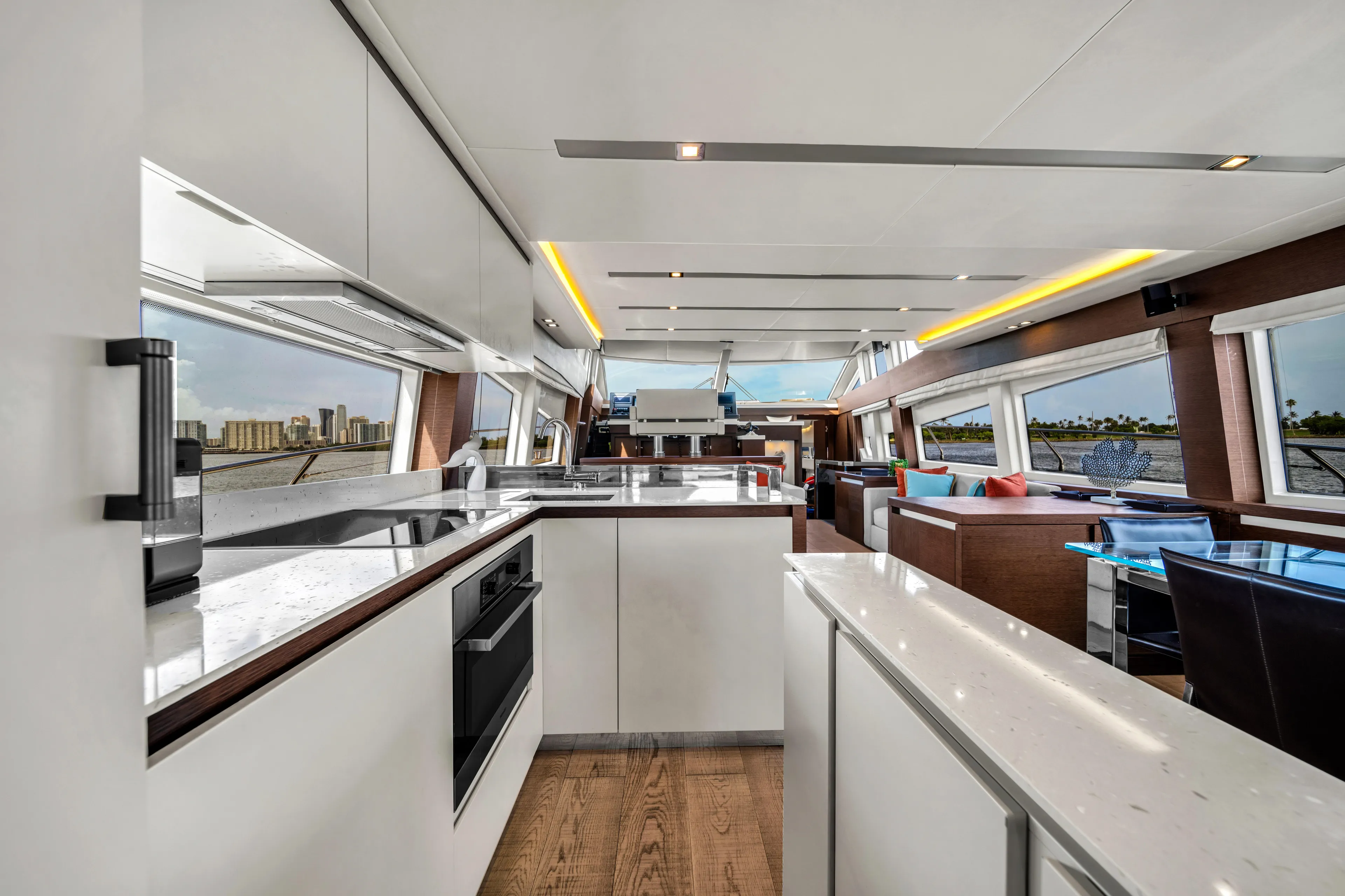 Oceana Yacht Photos Pics Luxurious interior of a 2015 Prestige 750 yacht with modern kitchen and panoramic windows.