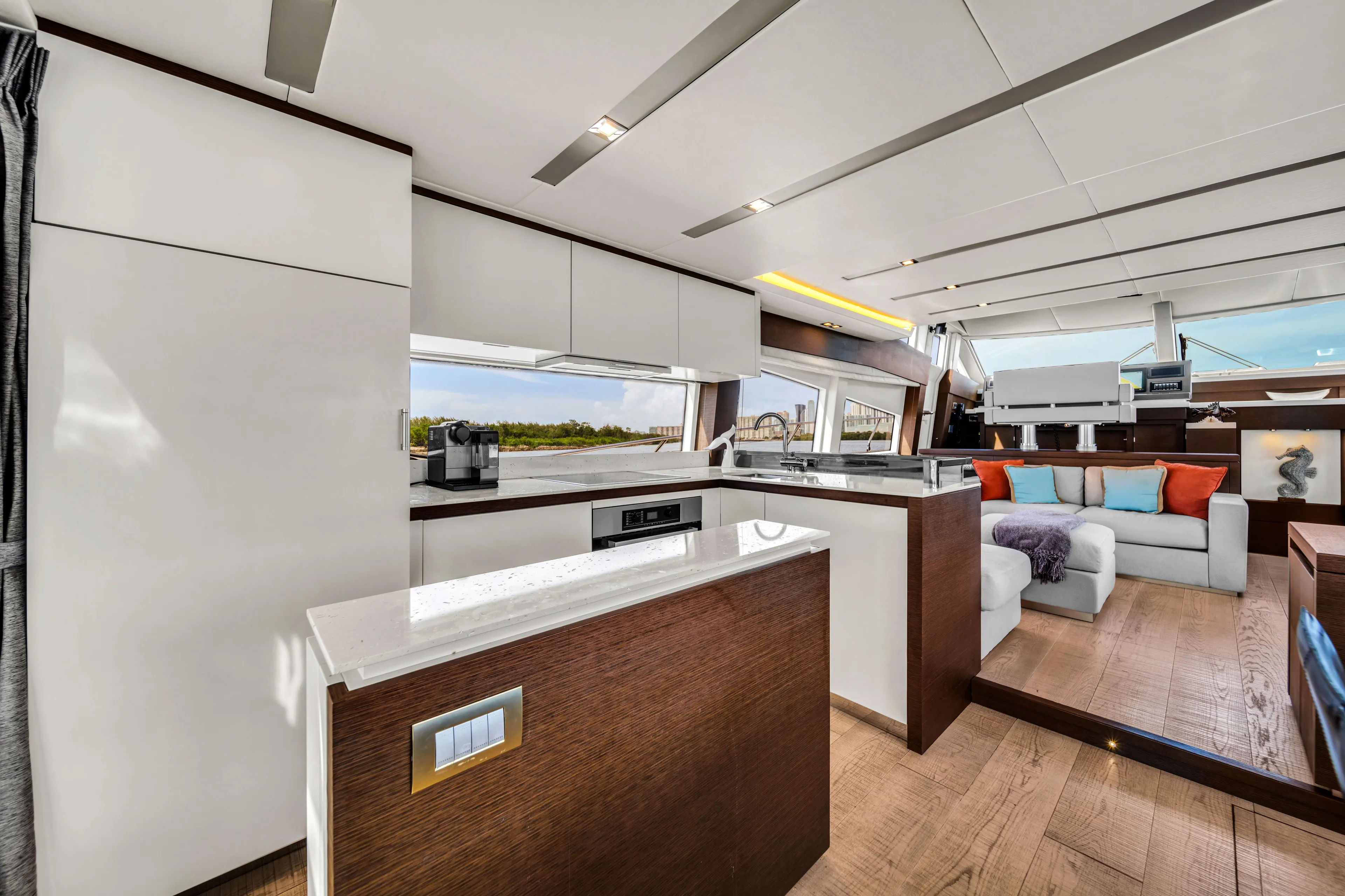 Oceana Yacht Photos Pics Luxurious interior of a 2015 Prestige 750 yacht with modern kitchen and seating area.