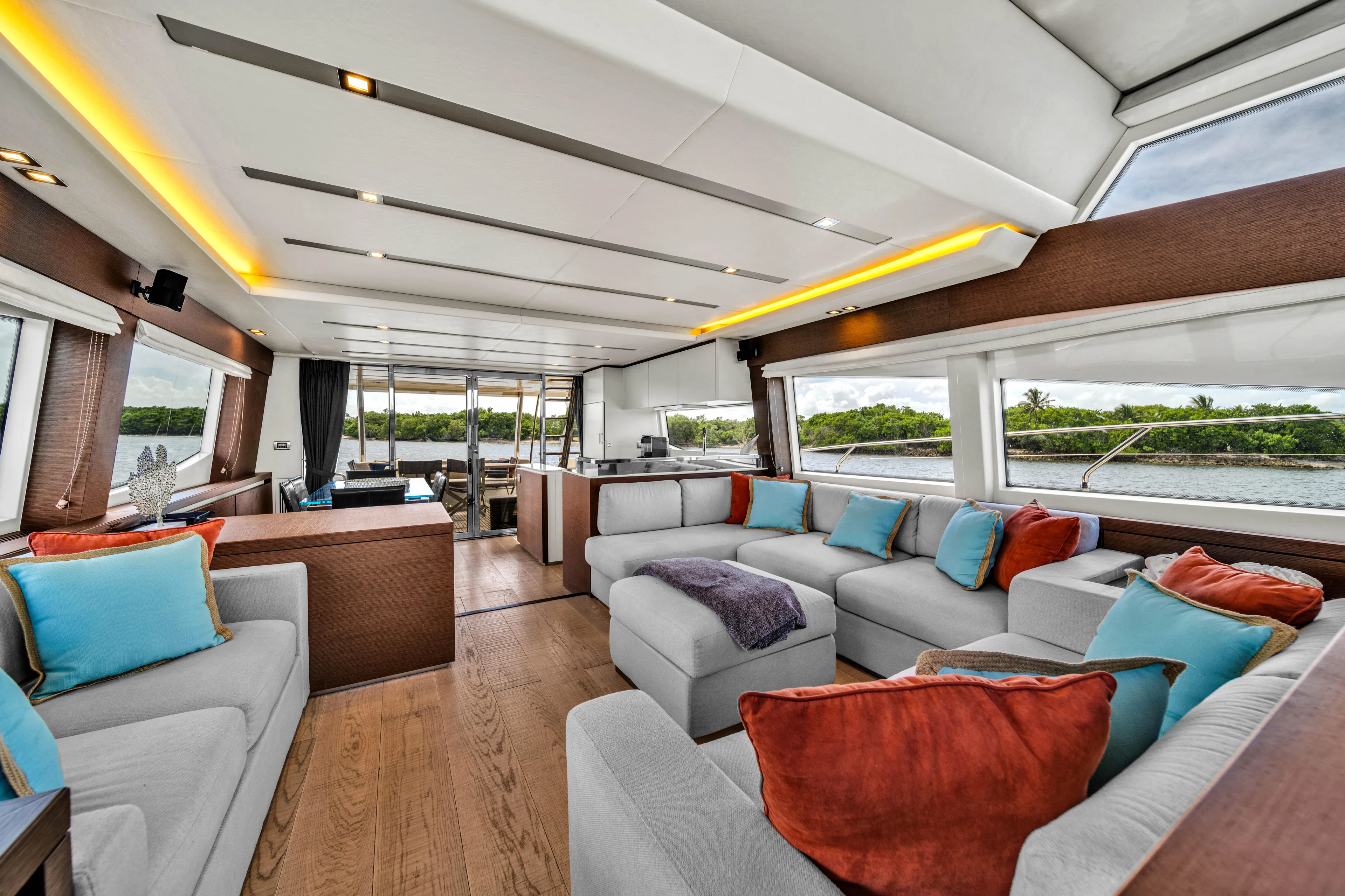 Oceana Yacht Photos Pics Luxurious interior of 2015 Prestige 750 yacht with modern seating and vibrant cushions.