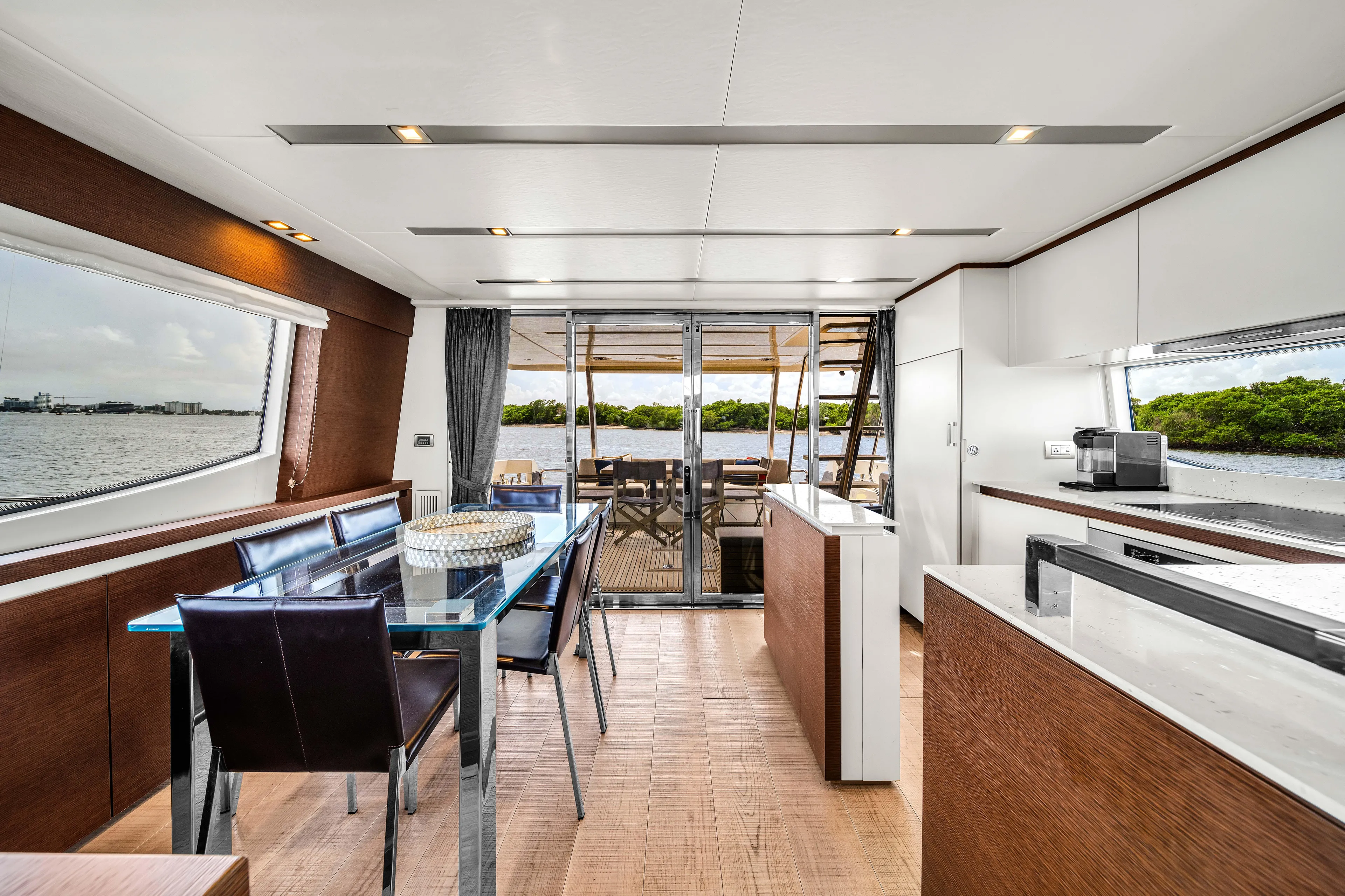 Oceana Yacht Photos Pics Luxurious interior of 2015 Prestige 750 yacht with modern dining area and scenic views.