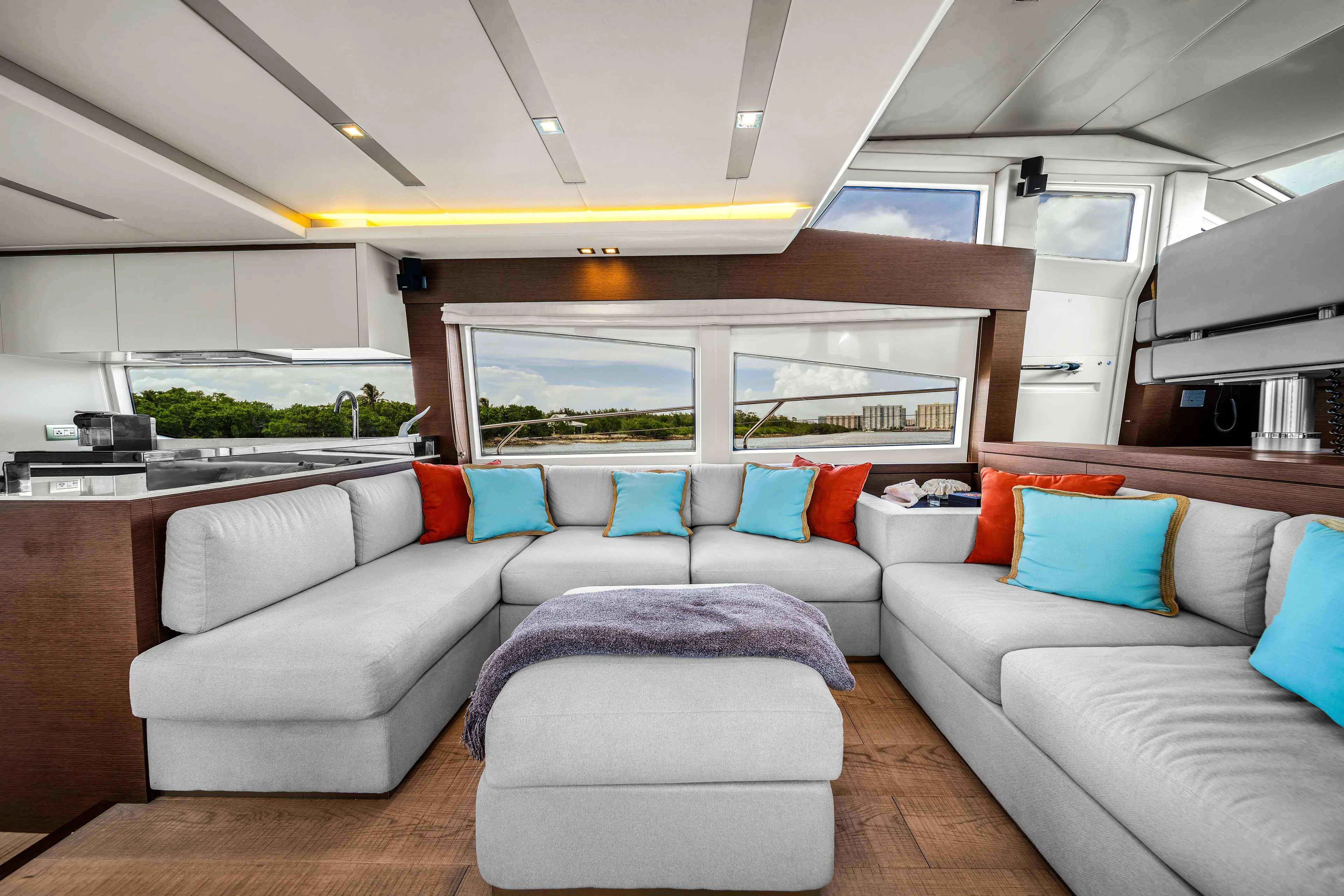 Oceana Yacht Photos Pics Luxurious interior of a 2015 Prestige 750 yacht with modern seating and colorful cushions.