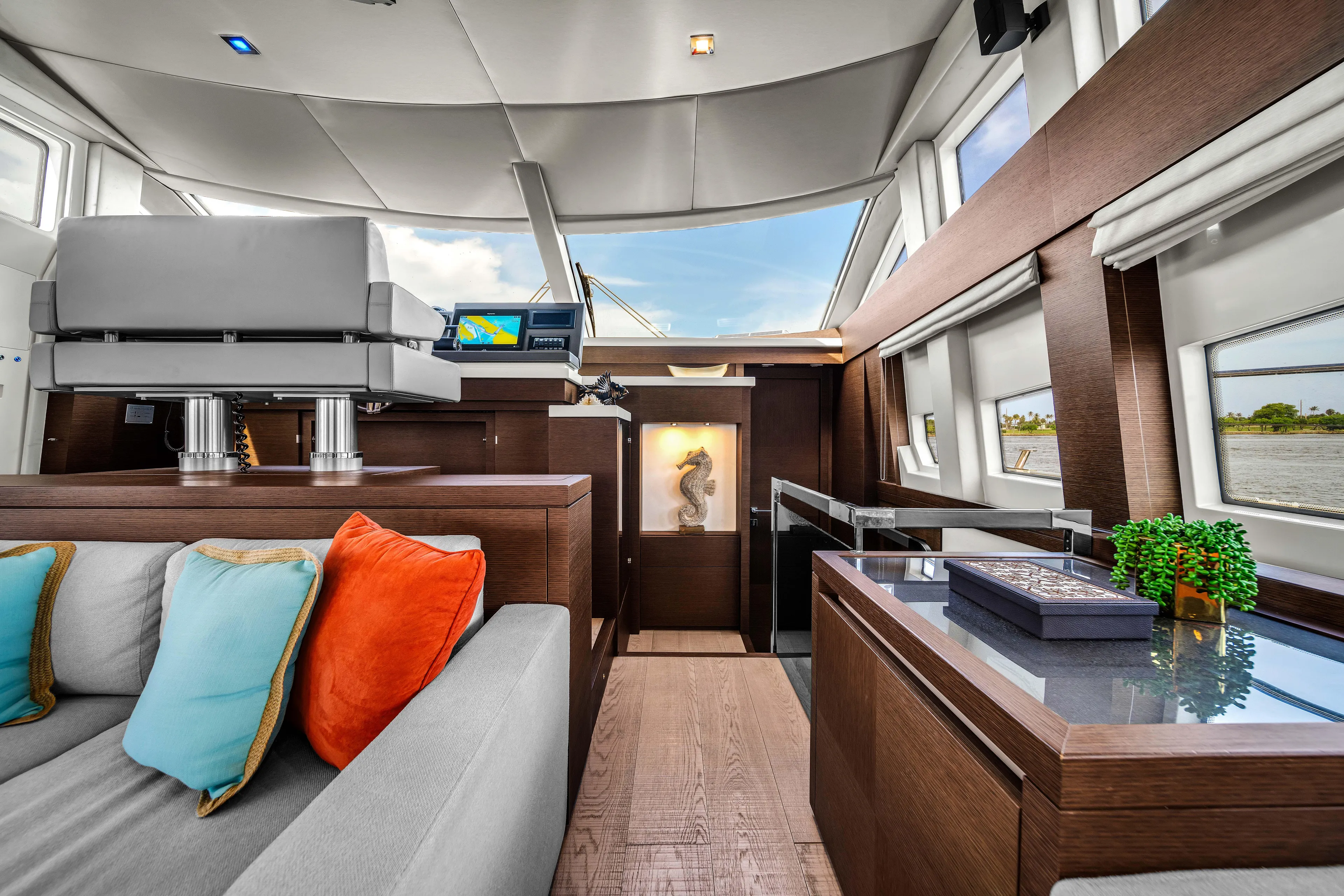 Oceana Yacht Photos Pics Luxurious interior of 2015 Prestige 750 yacht with modern decor and vibrant cushions.