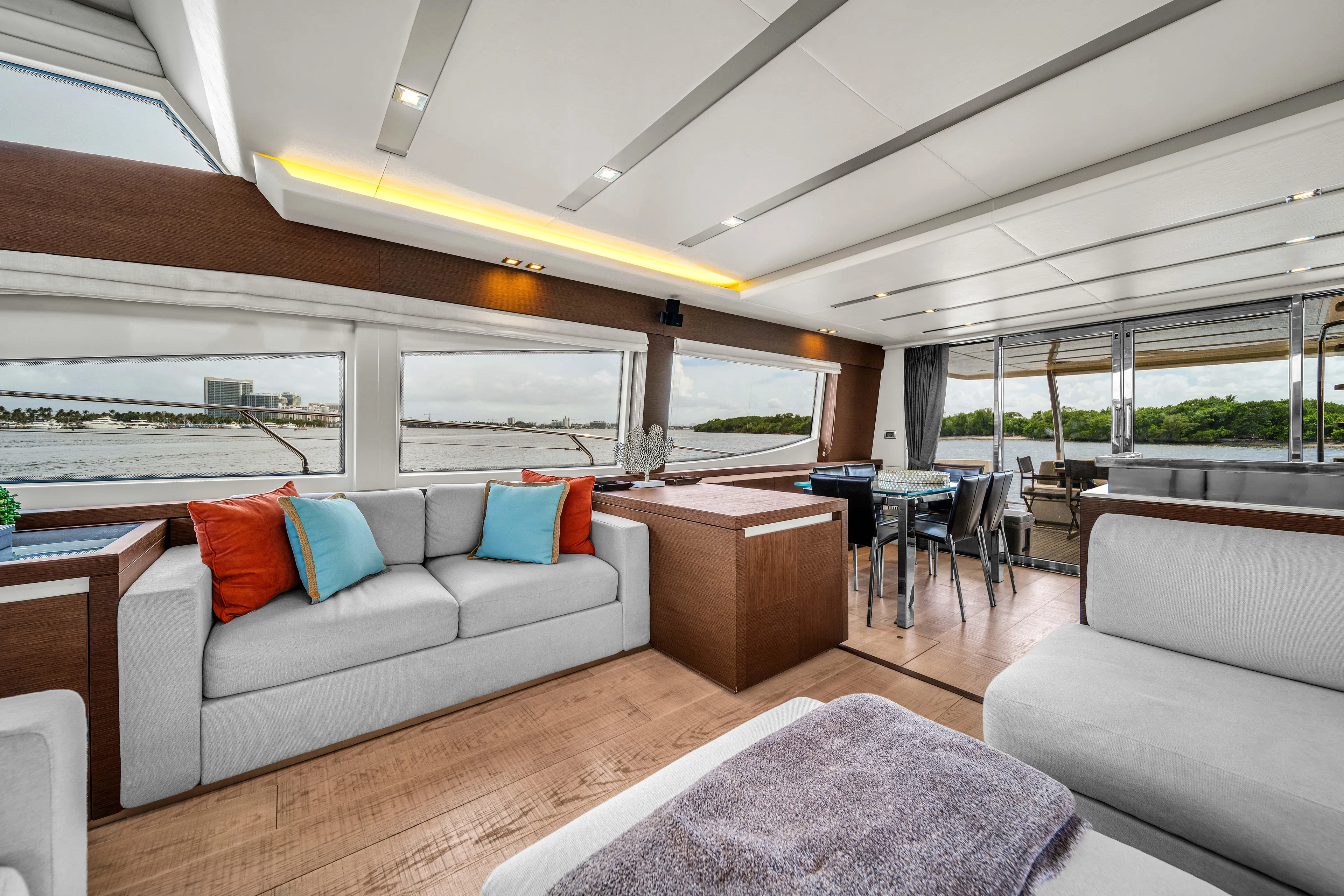 Oceana Yacht Photos Pics Luxurious interior of 2015 Prestige 750 yacht with modern seating and panoramic windows.