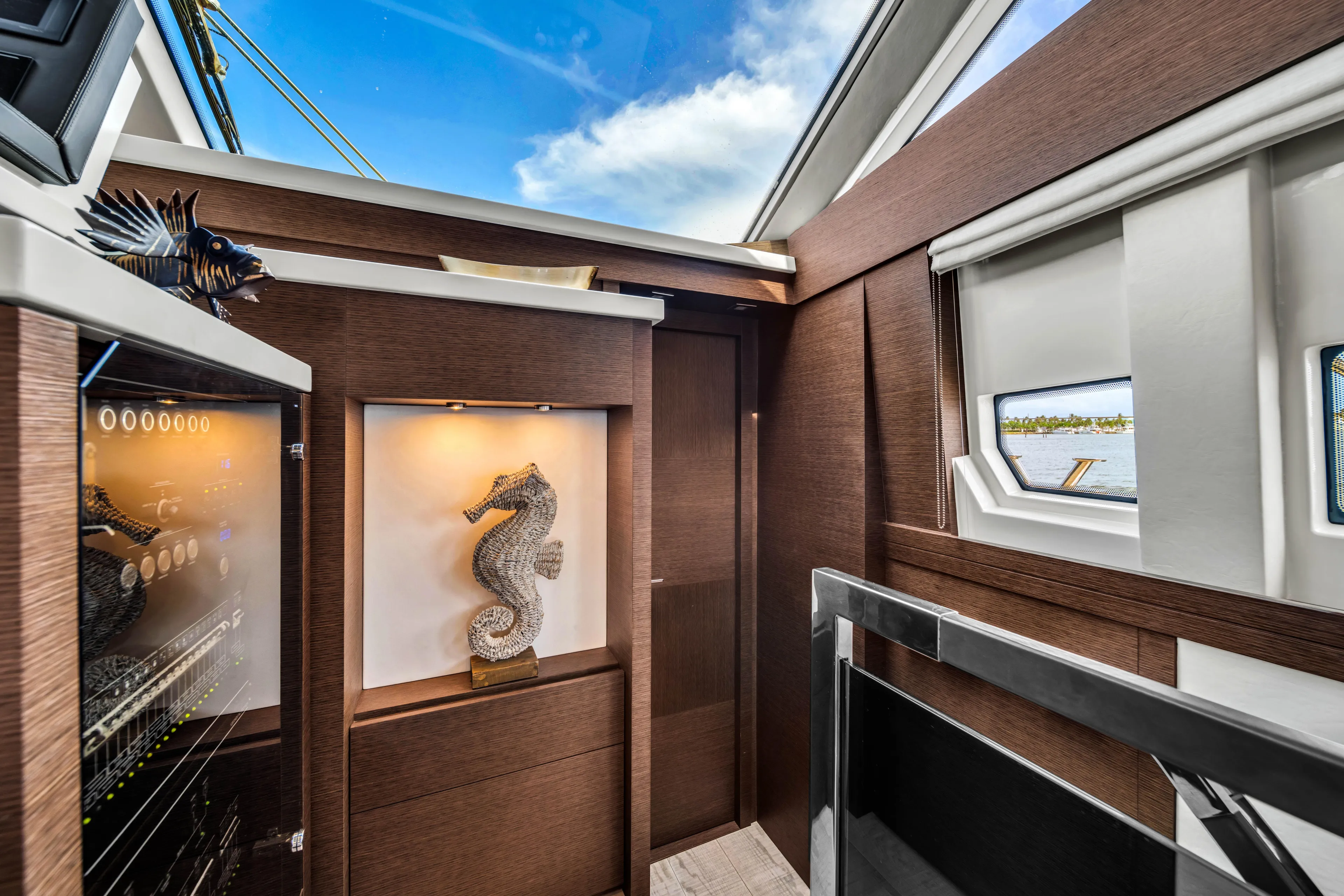 Oceana Yacht Photos Pics Luxurious interior of 2015 Prestige 750 yacht with elegant decor and seahorse sculpture.