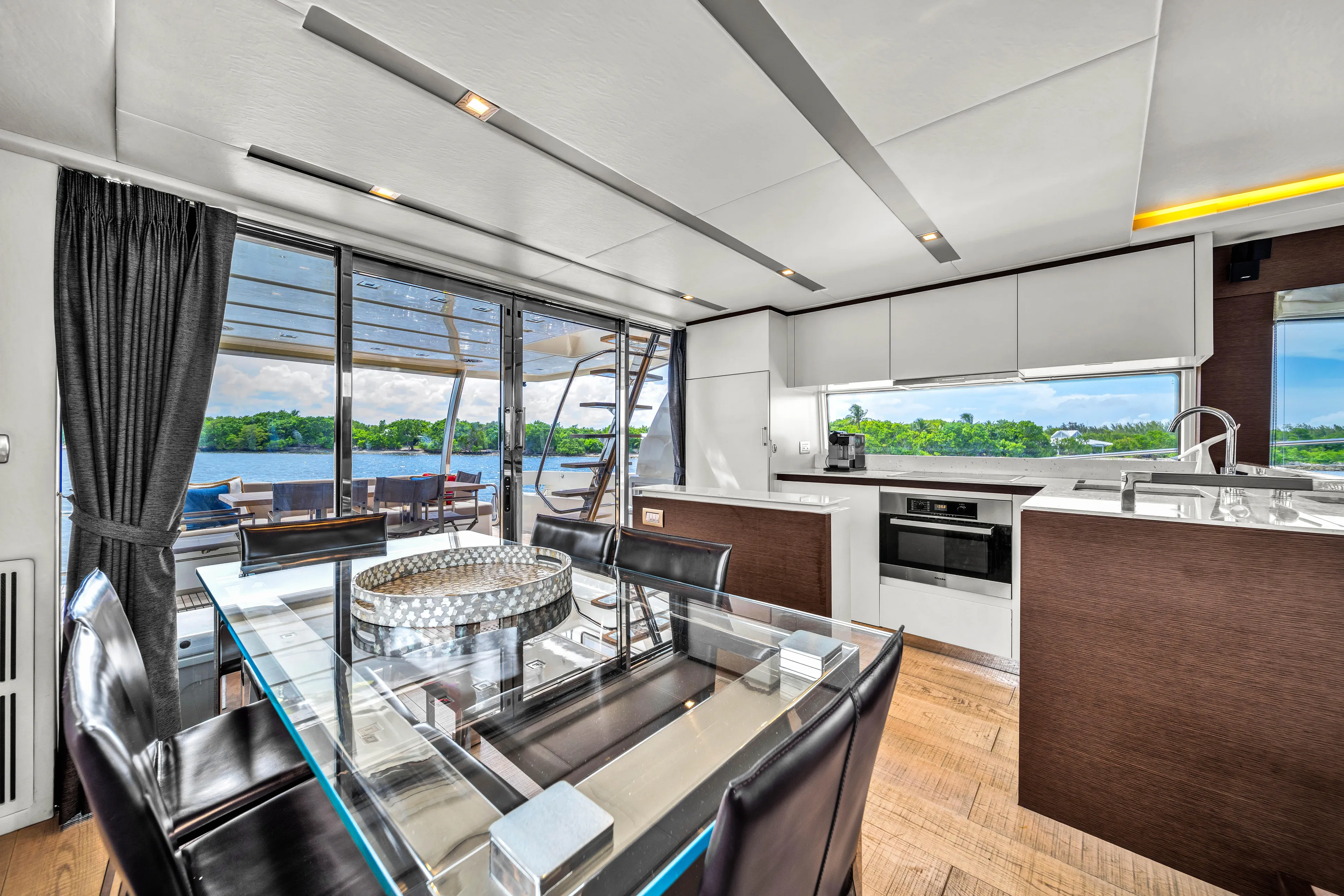 Oceana Yacht Photos Pics Luxurious interior of 2015 Prestige 750 yacht with modern kitchen and dining area.