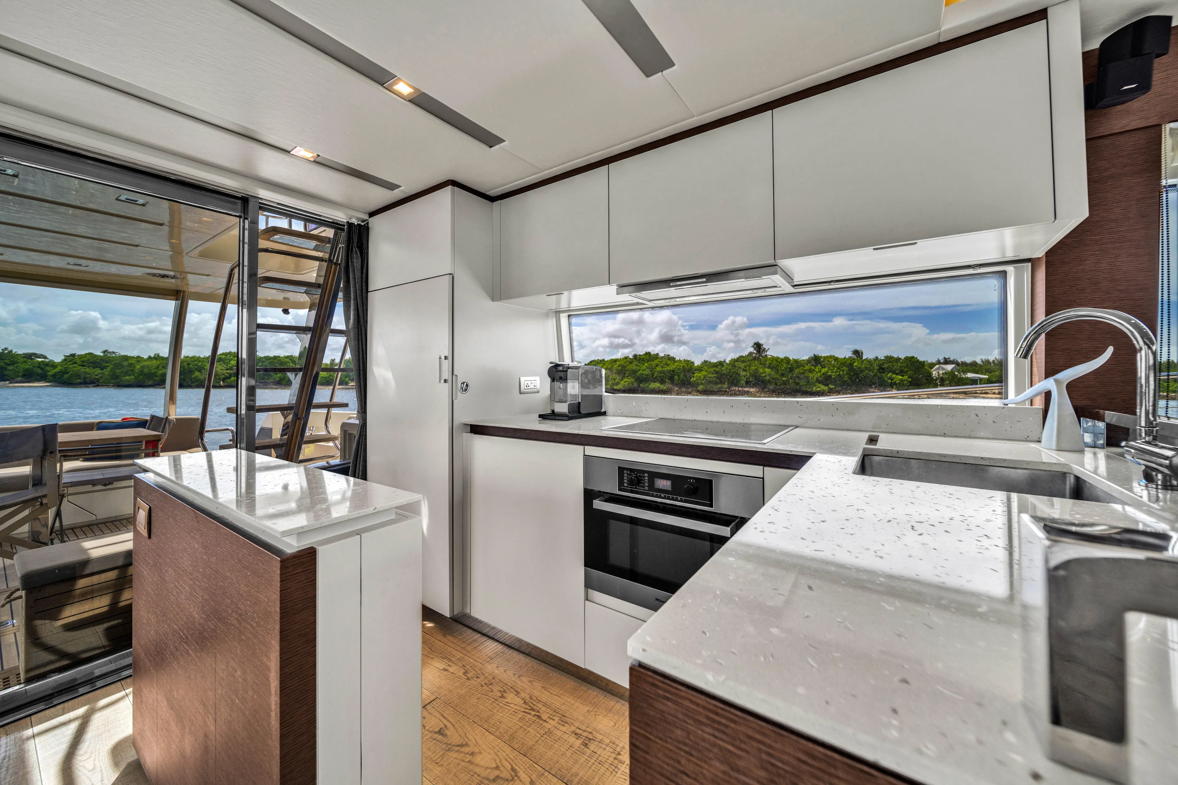Oceana Yacht Photos Pics Modern kitchen interior on a 2015 Prestige 750 yacht, featuring sleek design and scenic views.