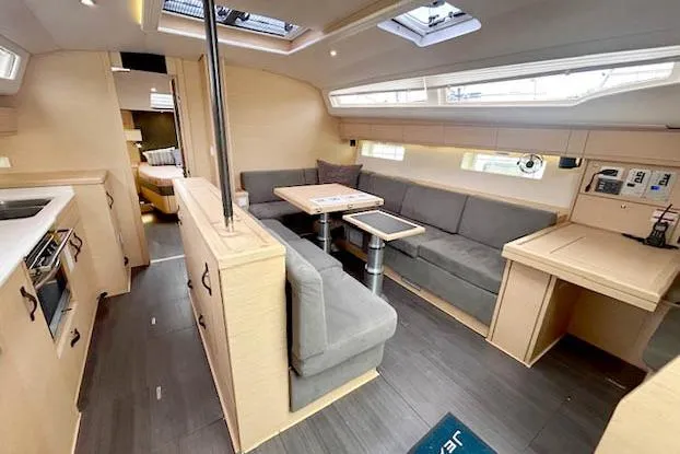Second Wind Yacht Photos Pics Interior of 2017 Jeanneau 54 yacht with modern seating and dining area.