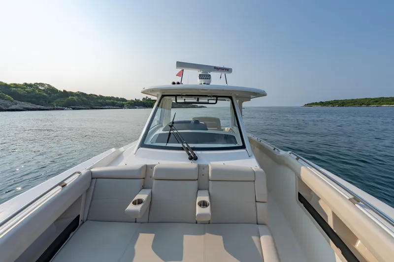 Blue Skies Yacht Photos Pics 2019 Boston Whaler 350 EX REALM boat cruising on calm waters.
