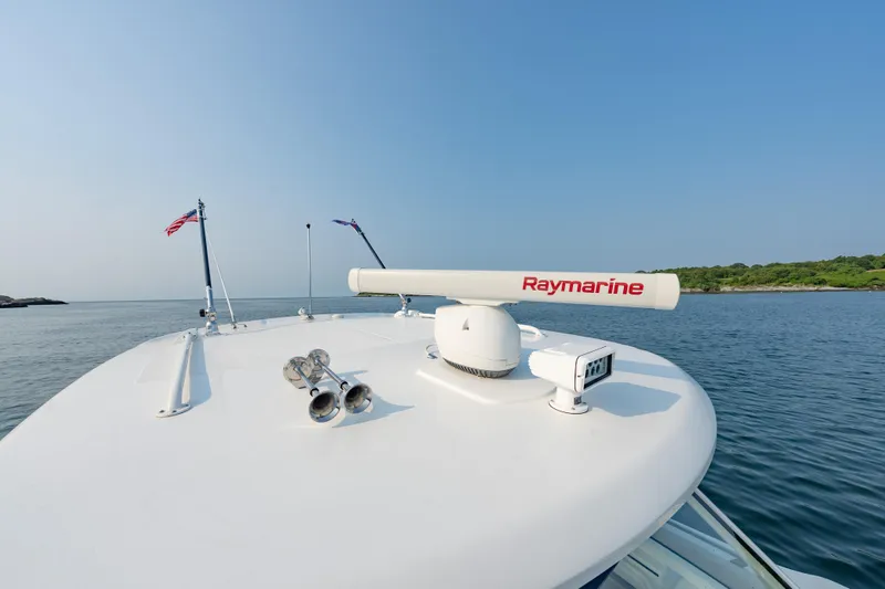 Blue Skies Yacht Photos Pics 2019 Boston Whaler 350 EX REALM boat with Raymarine radar on calm water.