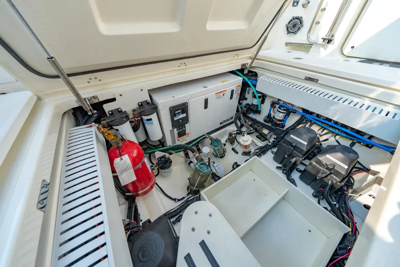 Blue Skies Yacht Photos Pics Engine compartment of 2019 Boston Whaler 350 EX REALM with Kohler generator and fire extinguisher.