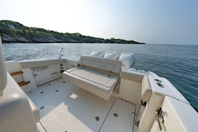 Blue Skies Yacht Photos Pics 2019 Boston Whaler 350 EX REALM boat with spacious deck and scenic ocean view.