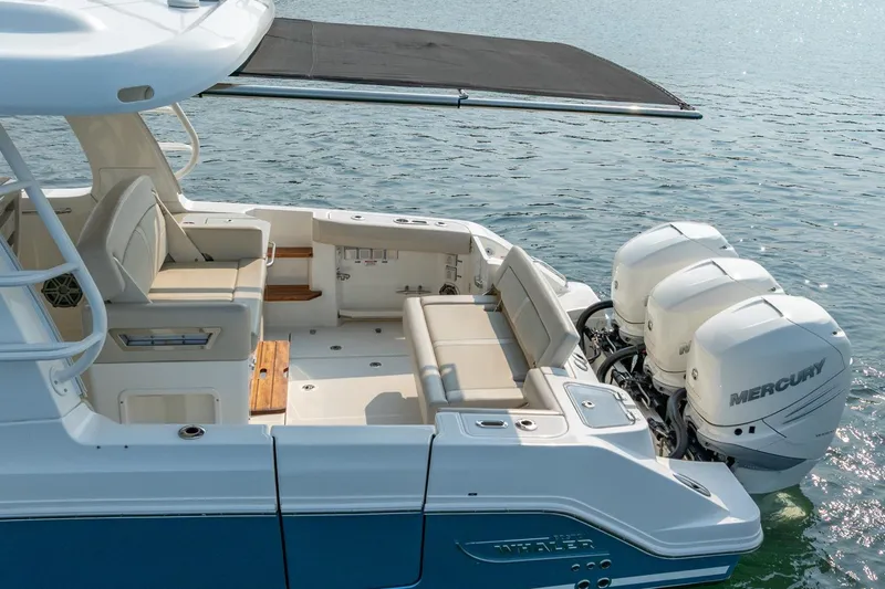 Blue Skies Yacht Photos Pics 2019 Boston Whaler 350 EX REALM boat with triple Mercury engines on water.