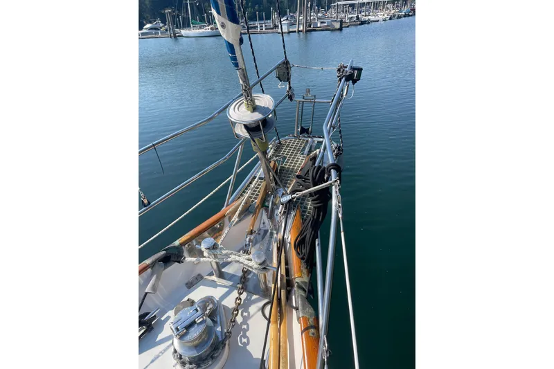 Sun Dazzler Yacht Photos Pics 1981 Mariner 48 sailboat deck with rigging, docked in a marina.