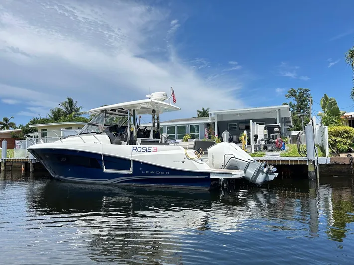 Rosie 3 Yacht Photos Pics 2022 Jeanneau Leader 10.5 WA Series 2 boat docked by waterfront home.