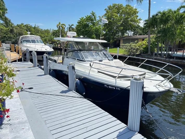 Rosie 3 Yacht Photos Pics 2022 Jeanneau Leader 10.5 WA Series 2 docked by a scenic waterfront.