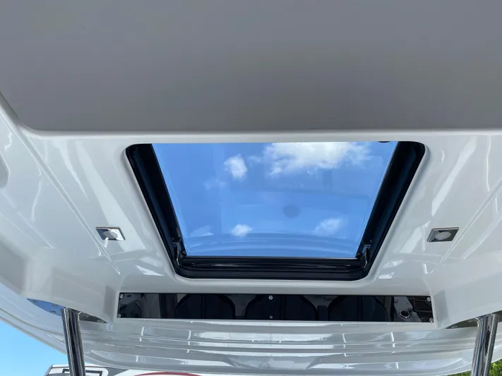 Rosie 3 Yacht Photos Pics Skylight view from Jeanneau Leader 10.5 WA Series 2, 2022 model, showcasing blue sky.