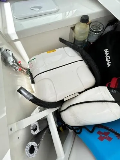 Rosie 3 Yacht Photos Pics Storage compartment of 2022 Jeanneau Leader 10.5 WA Series 2 with safety equipment and accessories.