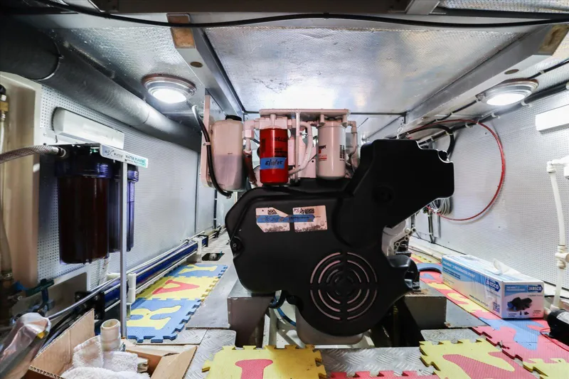 Rogue Yacht Photos Pics Engine room of 2007 North Pacific NP42 Pilothouse with visible machinery and equipment.