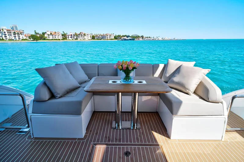 Raw Wave Yacht Photos Pics Luxurious 2021 Fairline Squadron 68 yacht deck with elegant seating and ocean view.