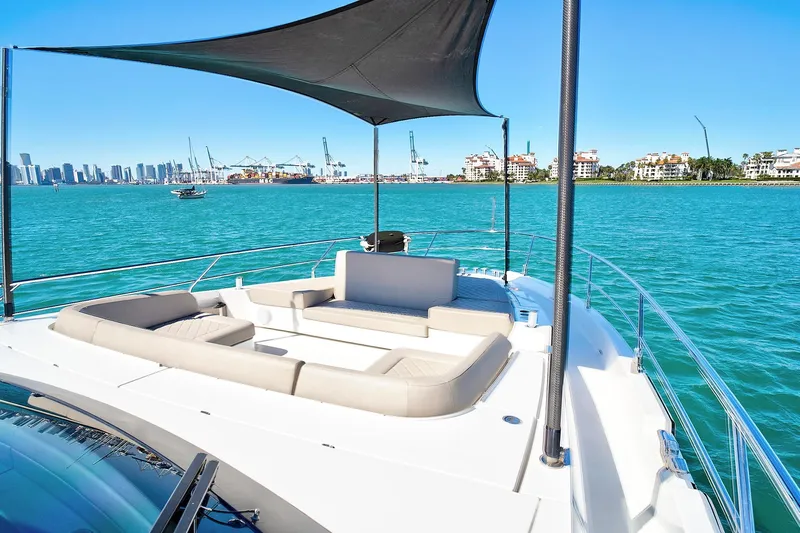 Raw Wave Yacht Photos Pics Luxury 2021 Fairline Squadron 68 yacht with spacious deck, city skyline view.