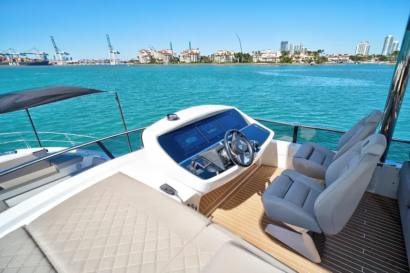Raw Wave Yacht Photos Pics 2021 Fairline Squadron 68 yacht helm with luxurious seating and ocean view.