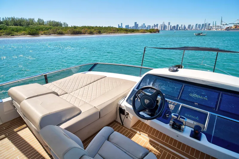Raw Wave Yacht Photos Pics Luxurious 2021 Fairline Squadron 68 yacht interior with stunning ocean view and modern navigation system.