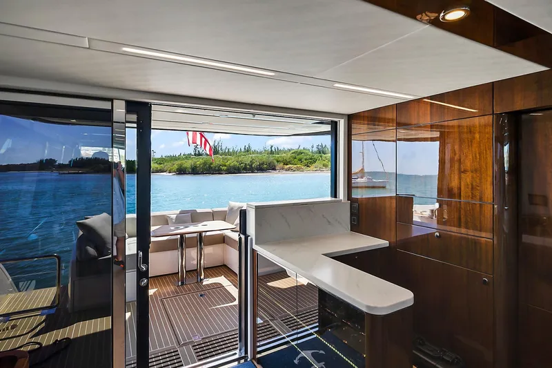 Raw Wave Yacht Photos Pics Luxurious interior of 2021 Fairline Squadron 68 yacht with ocean view.