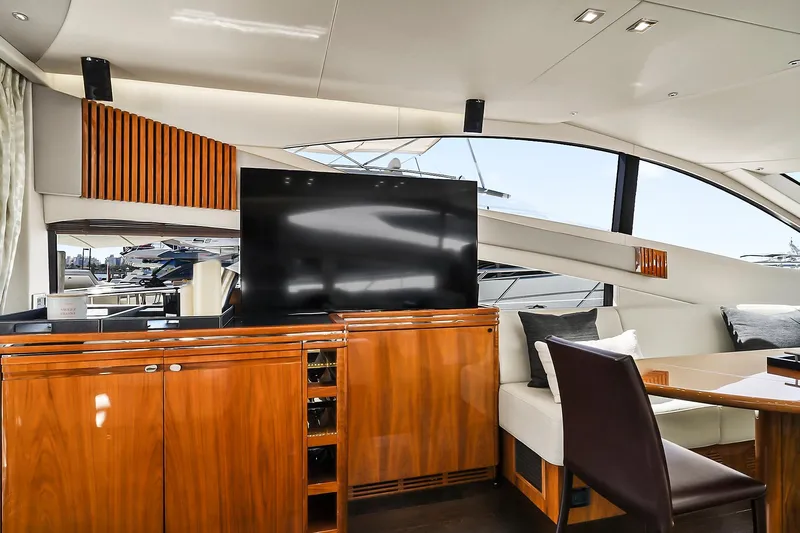 Raw Wave Yacht Photos Pics Luxurious interior of 2021 Fairline Squadron 68 yacht with elegant wood finishes and modern amenities.