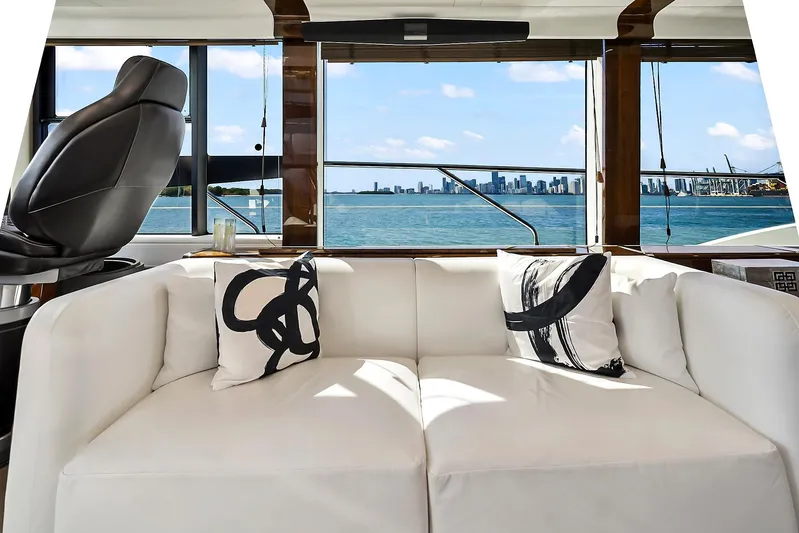 Raw Wave Yacht Photos Pics Luxurious interior of 2021 Fairline Squadron 68 yacht with ocean view and modern decor.