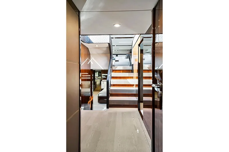 Raw Wave Yacht Photos Pics Interior view of 2021 Fairline Squadron 68 yacht, featuring modern staircase and luxurious design.