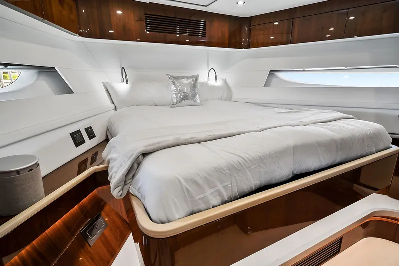 Raw Wave Yacht Photos Pics Luxurious bedroom interior of 2021 Fairline Squadron 68 yacht with elegant wood finishes.