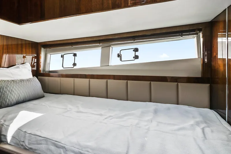 Raw Wave Yacht Photos Pics Luxurious cabin interior of 2021 Fairline Squadron 68 yacht with elegant bedding.