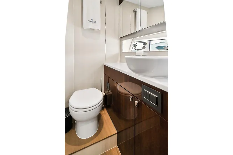 Raw Wave Yacht Photos Pics Luxurious bathroom in 2021 Fairline Squadron 68 yacht, featuring modern fixtures and elegant design.
