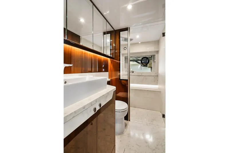 Raw Wave Yacht Photos Pics Luxurious bathroom in 2021 Fairline Squadron 68 yacht with marble and wood finishes.