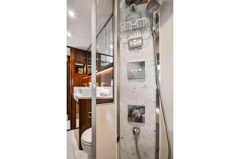 Raw Wave Yacht Photos Pics Luxurious bathroom in 2021 Fairline Squadron 68 yacht with marble shower and modern fixtures.