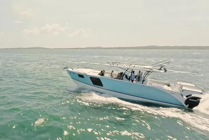  Yacht Photos Pics 2024 YachtCat 41 cruising on open water with passengers enjoying the ride.