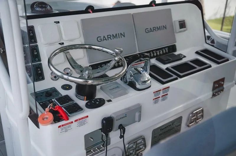  Yacht Photos Pics Control panel of 2024 YachtCat 41 featuring dual Garmin displays and modern navigation equipment.