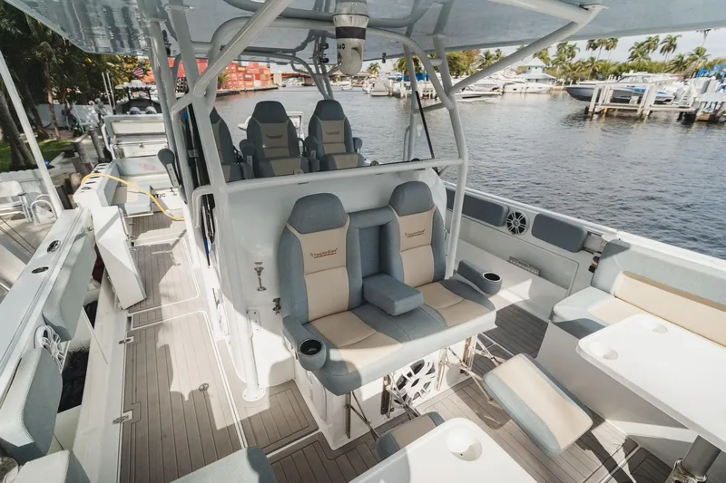  Yacht Photos Pics Luxurious 2024 YachtCat 41 interior with plush seating and modern design by the waterfront.
